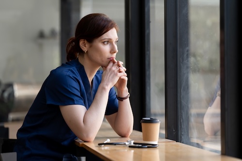 Nurse reflecting quietly